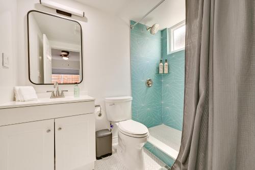 a bathroom with a toilet and a sink and a shower at Sleek San Diego Vacation Rental with Private Patio! in San Diego