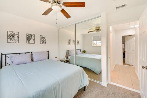 a bedroom with two beds and a ceiling fan at Sleek San Diego Vacation Rental with Private Patio! in San Diego
