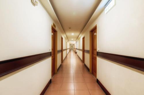 a corridor of an empty hallway in an office building at Toong Hsiang Hotel in Green Island