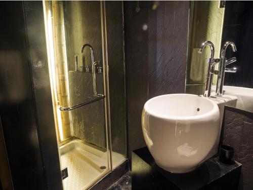 a bathroom with a urinal and a shower at Thang Long Espana Hotel in Hanoi