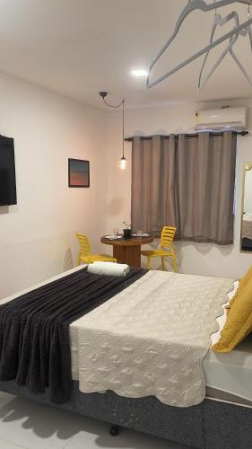 Suite Sol - Residencial Vivas tesisinde bir odada yatak veya yataklar