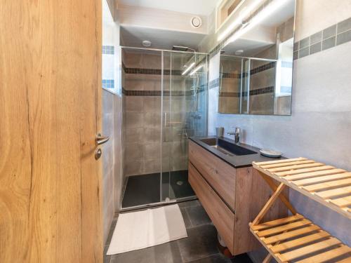 a bathroom with a sink and a shower at Splendid home near the Spa Francorchamps circuit in Stavelot
