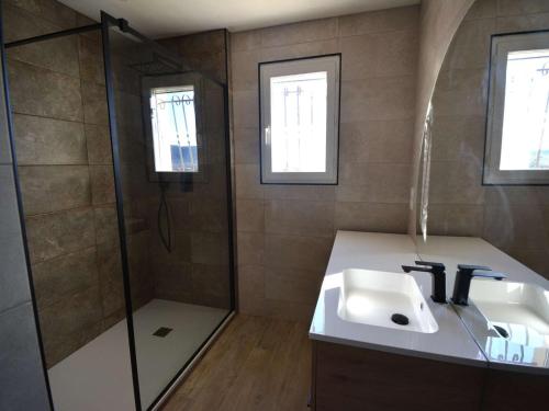 a bathroom with a sink and a shower at Maison Saint-Remèze, 5 pièces, 8 personnes - FR-1-382-201 in Saint-Remèze