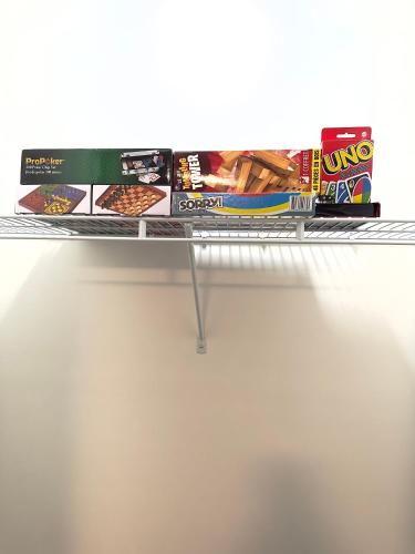 a metal shelf with some food on top of it at Stylish House W a Media Room Near Downtown Picton in Picton