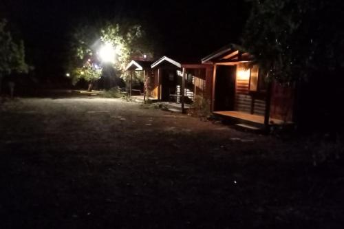 a cabin at night with a light in the dark at Doğal,Kaliteli,Huzurlu,Avantajli in Döşeme