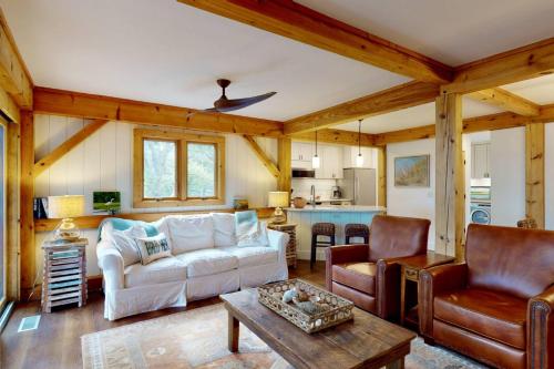 a living room with a couch and a table at Marsh Haven in Southport