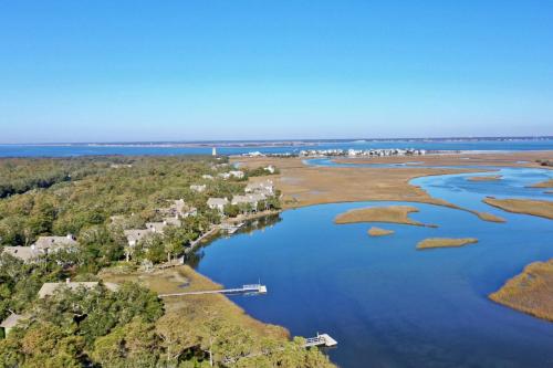 an aerial view of the shoreline of a lake at Marsh Haven in Southport