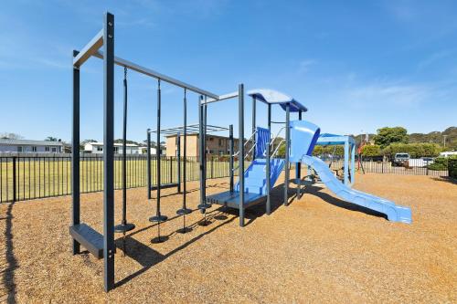 a playground with a slide in a park at Apollo Unit 1 - Ground Floor - A Block in Narooma