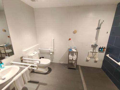 a bathroom with a toilet and a sink at Holiday Inn Express Xiamen Airport Zone by IHG in Xiamen