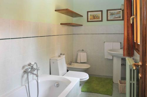 a bathroom with a white toilet and a sink at Holiday home in Vicchio - Toskana 27442 in Vicchio