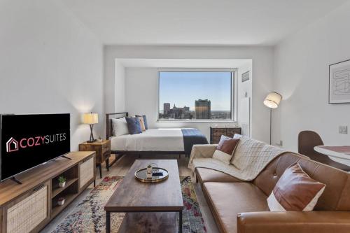 a living room with a couch and a bed at Boardwalk CozySuites Condo with kitchen 45 in Atlantic City