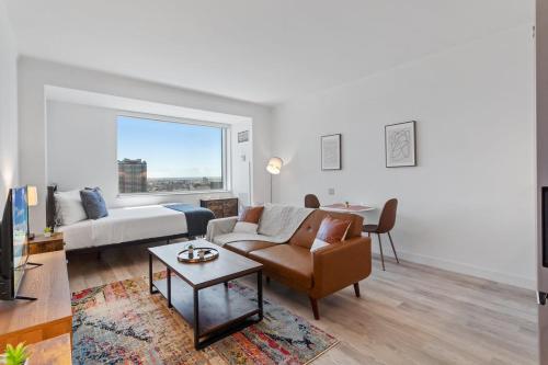 a living room with a couch and a table at Boardwalk CozySuites Condo with kitchen 45 in Atlantic City