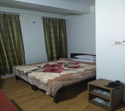 Ένα ή περισσότερα κρεβάτια σε δωμάτιο στο StayApart - Sikkim Regency