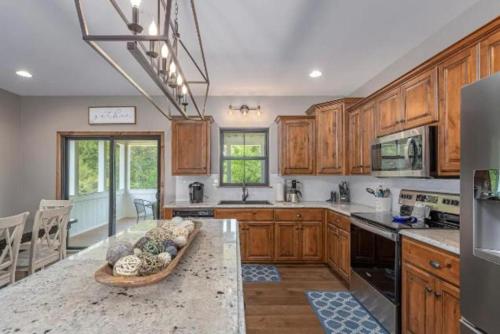 a kitchen with wooden cabinets and a counter top at SPACIOUS FAMiLY HOME in Hollister