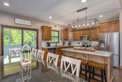 a kitchen with wooden cabinets and a large kitchen island at SPACIOUS FAMiLY HOME in Hollister