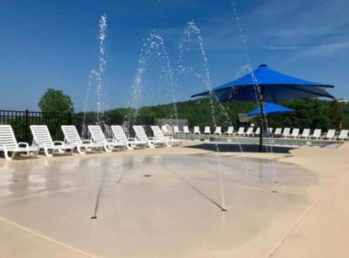a group of chairs and an umbrella and fountain at SPACIOUS FAMiLY HOME in Hollister