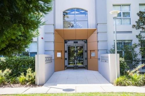 a building with a door in front of it at Trieste 13 in Canberra