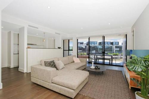 a living room with a couch and a table at The Prince 228 Kingston ACT in Canberra