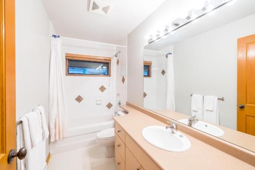 a bathroom with a sink and a toilet at #8107 Muirfield Crescent in Whistler