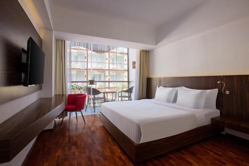 Postel nebo postele na pokoji v ubytování The Bene Hotel