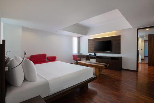 Postel nebo postele na pokoji v ubytování The Bene Hotel