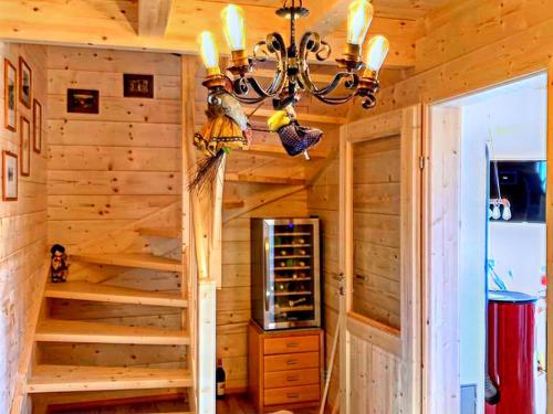 a log cabin with stairs to a wine cellar at Chalet in Bad Leonhard near Klippitztörl Slopes in Klippitztorl