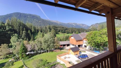 an aerial view of a house in the mountains at Burglodge Fischerkeusche in Mauterndorf