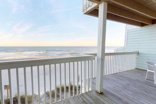 a balcony with a view of the ocean at Sand Castle in Kure Beach