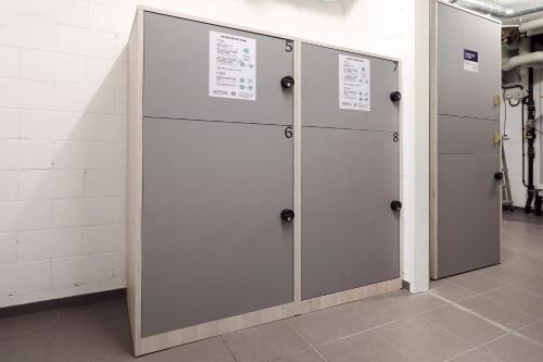 a row of metal lockers in a room at Numa Zurich Turi in Zürich