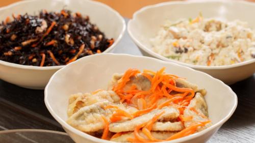 a group of bowls of food on a table at Meitetsu Inn Nagoya Kanayama in Nagoya