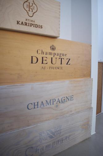 a sign for a chardonnay wine cellar at Irini Rooms in Naousa
