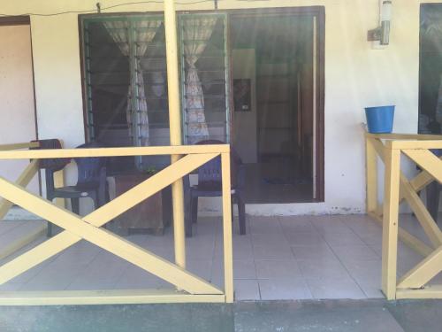 a table and chairs in front of a window at Waya Lailai Eco Haven in Wayasewa Island