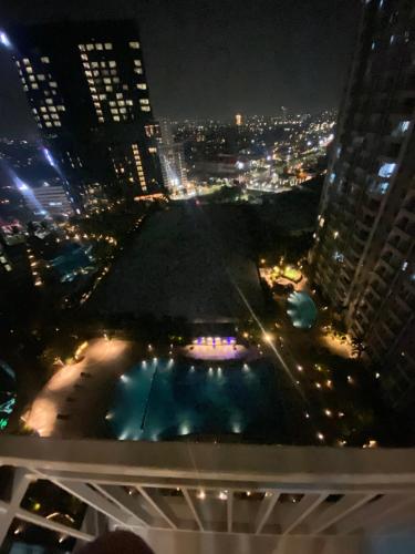 a view from the top of a building at night at Elegance Orchard in Surabaya
