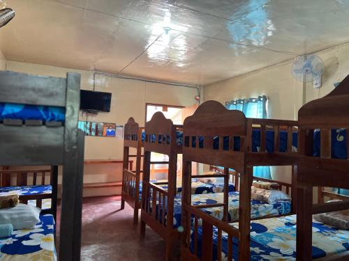 a group of bunk beds in a room at Gratum Beach Resort in Dapitan