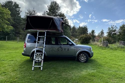 a truck with a ladder on the top of it at Discovery 4 - Family Camper in Inshes