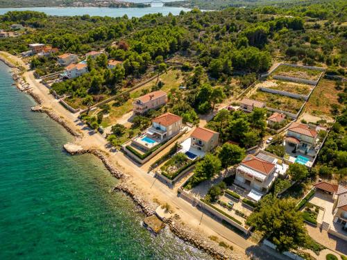 an aerial view of a house next to the water at Villa Tatijana ZadarVillas in Kukljica