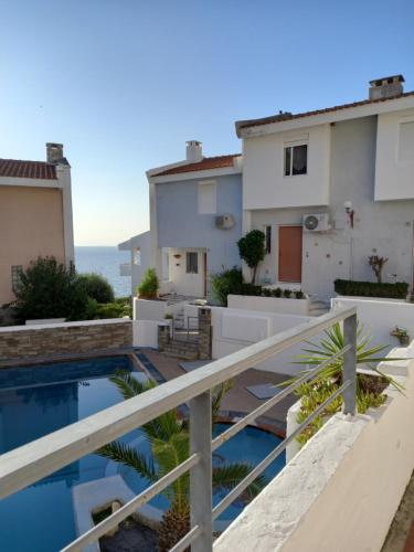 a view from the balcony of a house with a swimming pool at Siviri kassandras Xalkidiki, Experience Accomodation in Siviri