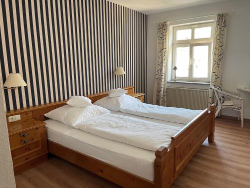 Postel nebo postele na pokoji v ubytování Hotel Jungbräu