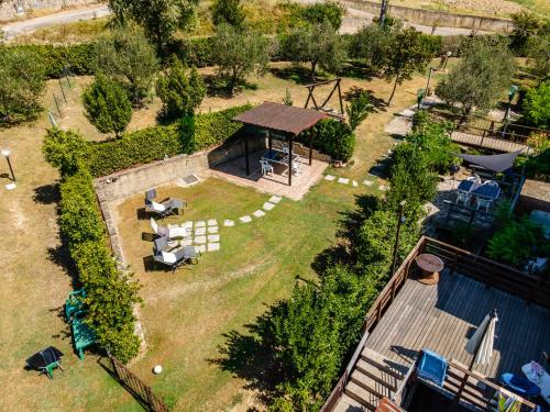 an aerial view of a garden with a gazebo at Sole Verde green house in Terricciola