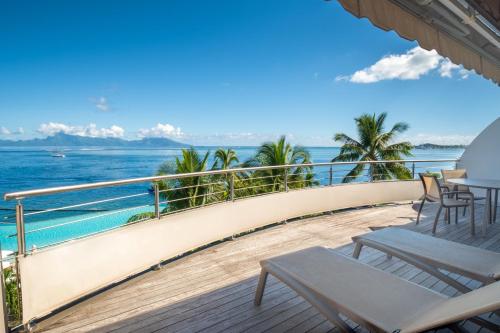 a balcony with a view of the ocean at Te Moana Tahiti Resort in Punaauia