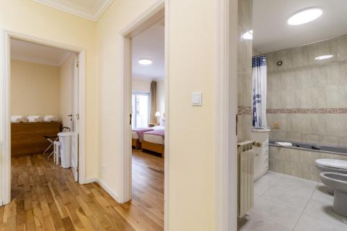 a bathroom with a sink and a toilet in a room at Lysa's House in Amorosa