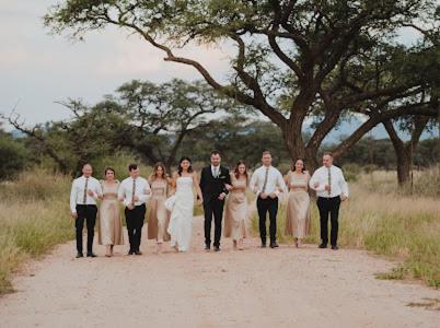a group of people walking down a dirt road at Out Of Nature Country Lodge in Windhoek