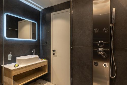 a bathroom with a sink and a shower at CITY HILL Luxury Apartments in Ioannina