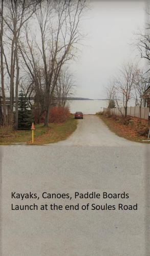 a road with the words kayaksannisannisannisannisandalsandalsandals launch at at Happyland Inn in Orillia