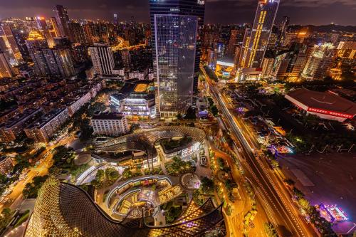 a city at night with traffic and buildings at WAIFIDEN Guangzhou Grand View Golden Palace Apartment in Guangzhou
