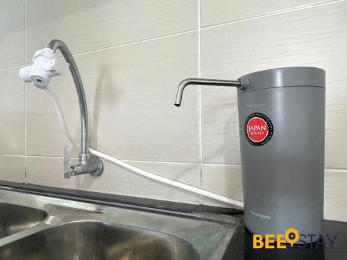 a water mixer sitting next to a sink at KLIA Ehsan Residences Sepang Nilai in Sepang