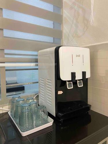 a coffee machine sitting on top of a counter at Homestay 2 @Taman Teluk Intan in Teluk Intan