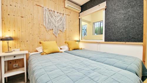 Ένα ή περισσότερα κρεβάτια σε δωμάτιο στο AA Guest - Mi Casa Eco Front Sea Views