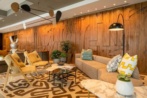a living room with a couch and chairs at Hilton San Diego Gaslamp Quarter in San Diego