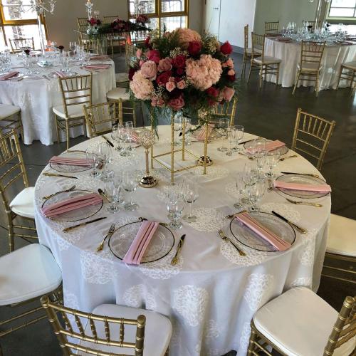 a table with a white table cloth and flowers on it at Hilton San Diego Gaslamp Quarter in San Diego